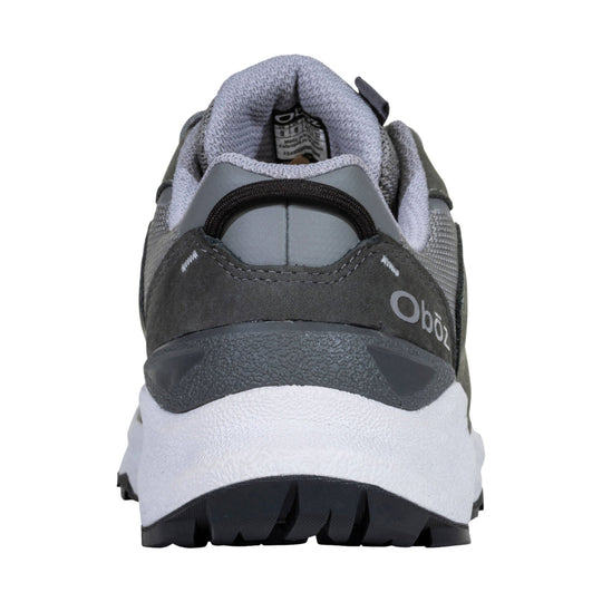Rear view of a gray and black waterproof hiking shoe with a white midsole and rugged tread