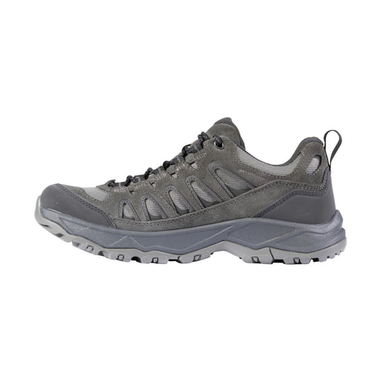 Gray low-top hiking shoe with mesh and suede panels, black laces, and a rugged lug sole