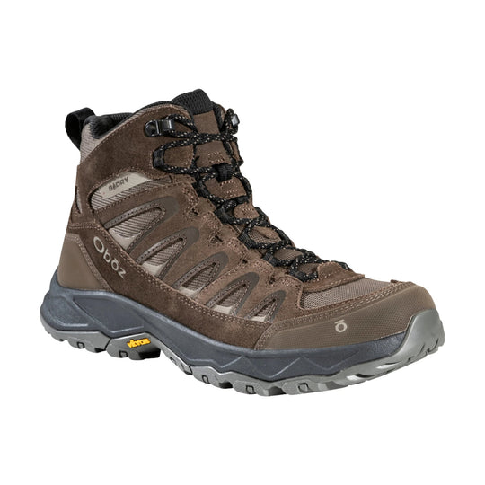Brown mid-height hiking boot with black laces, gray sole, and visible Vibram branding