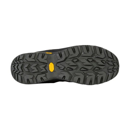 Black hiking boot outsole with deep tread and yellow Vibram logo