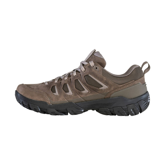 Brown low hiking shoe with mesh panels, lace-up front, and rugged black outsole