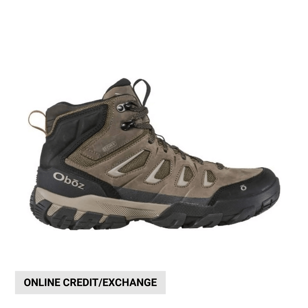 Brown and black mid-height hiking boot with rugged tread and visible lacing, shown in side profile
