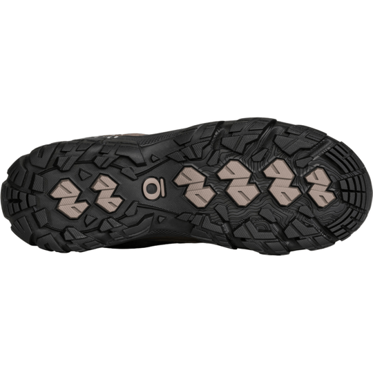 Black hiking boot outsole with beige traction lugs and an Oboz logo