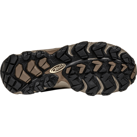 Black and tan lugged hiking boot outsole with Oboz logo