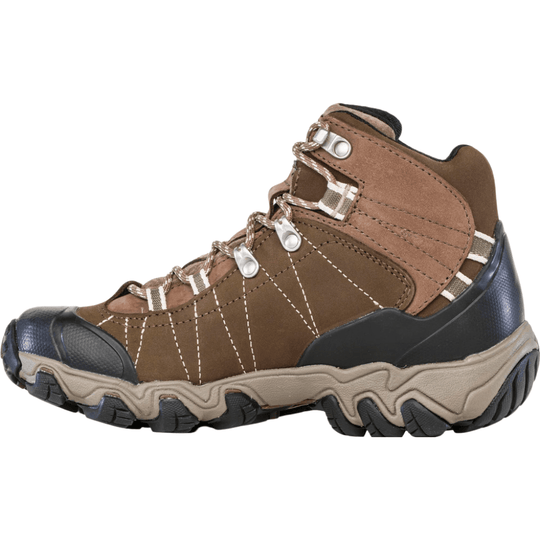 Brown mid-height hiking boot with black rubber toe cap, beige midsole, and white stitching