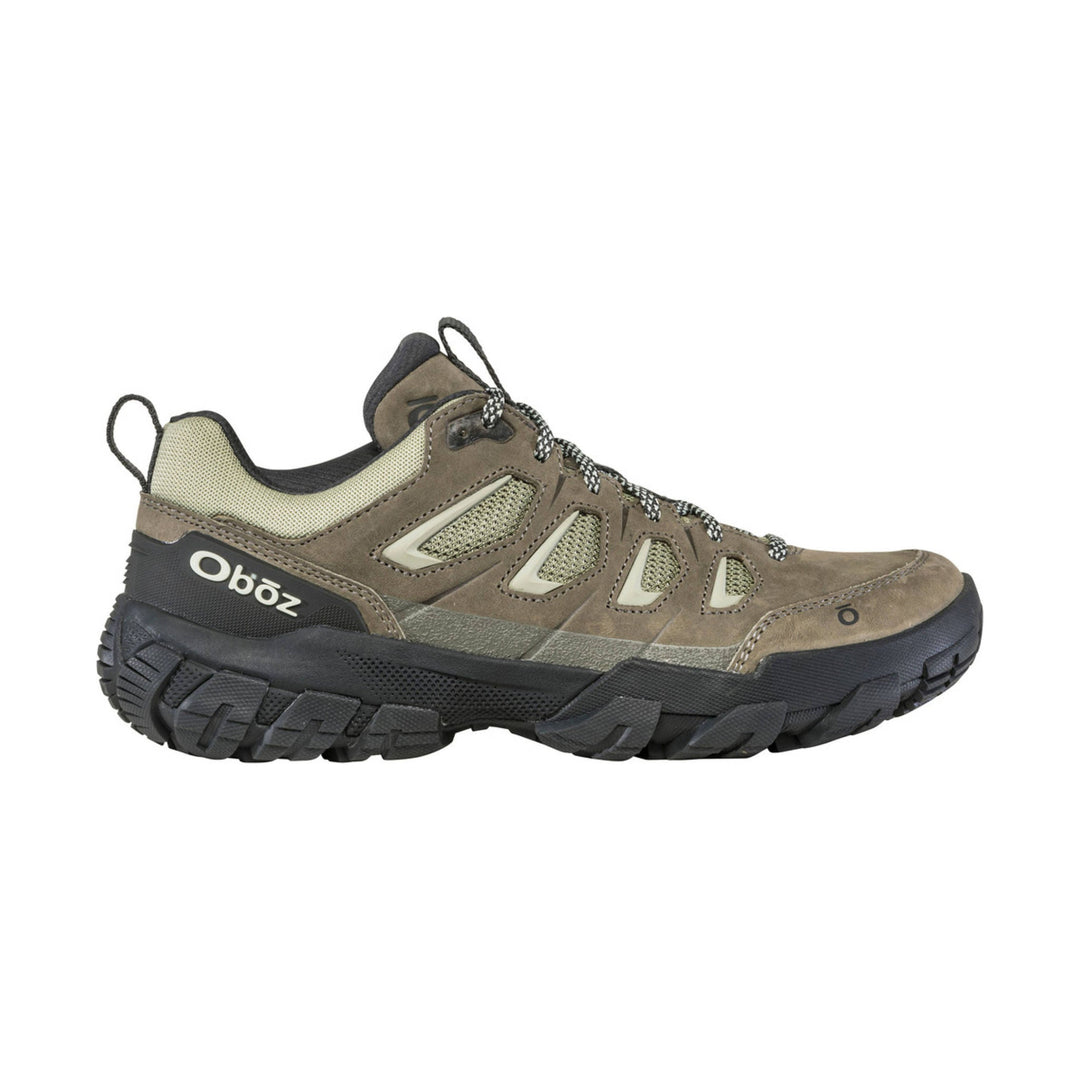 Brown and tan low-cut hiking shoe with mesh panels, black outsole, and bungee laces