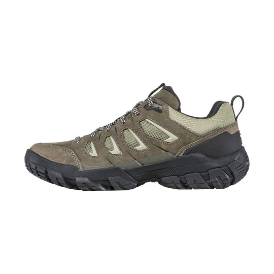 Low hiking shoe in olive and tan with mesh panels, bungee laces, and a black treaded sole