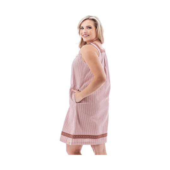 Pink sleeveless dress with pleated texture, side pockets, and patterned trim at the hem and shoulders