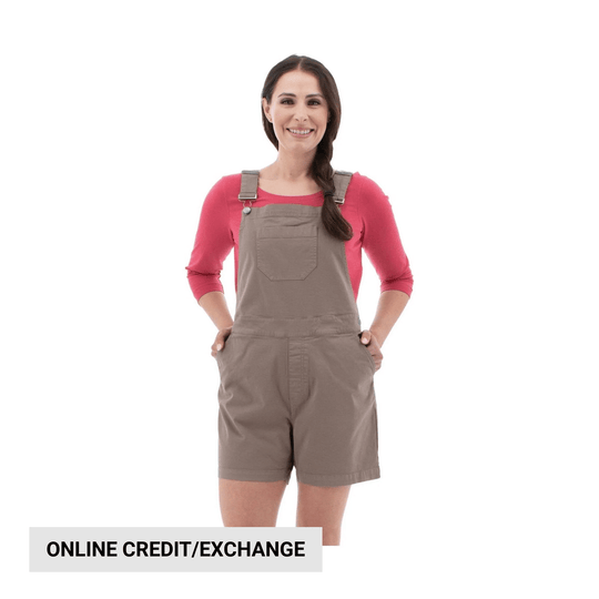 Woman wearing taupe short overalls over a pink top, with visible text reading "ONLINE CREDIT/EXCHANGE"