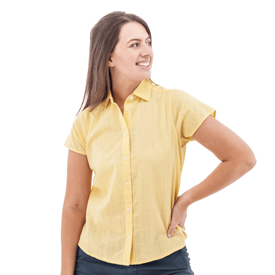 Yellow short-sleeve button-up camp shirt on a woman, shown in a three-quarter view