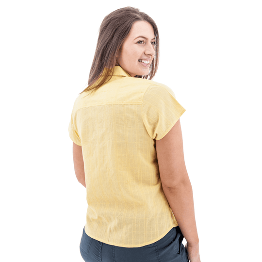 Yellow short-sleeve camp shirt shown from the back on a model