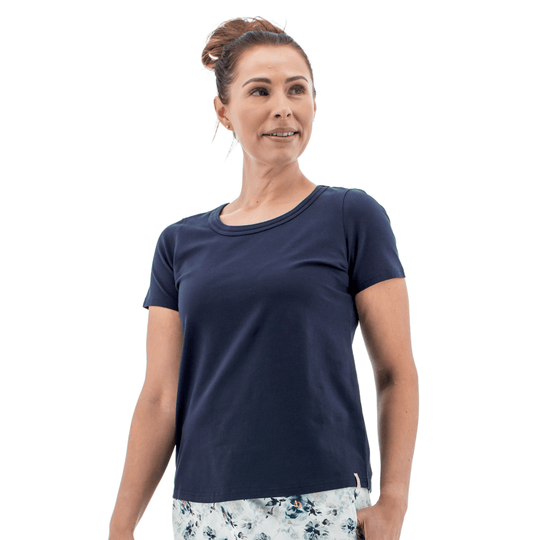 Navy short-sleeve crewneck tee on a model with floral pants