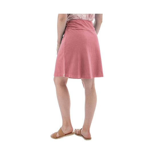 Pink knee-length wrap skirt with ruched waistband, shown from the back with tan sandals