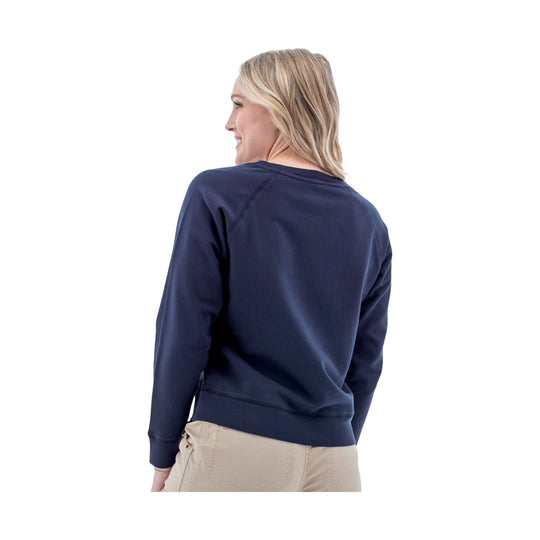 Woman wearing a navy long-sleeve sweatshirt, shown from the back