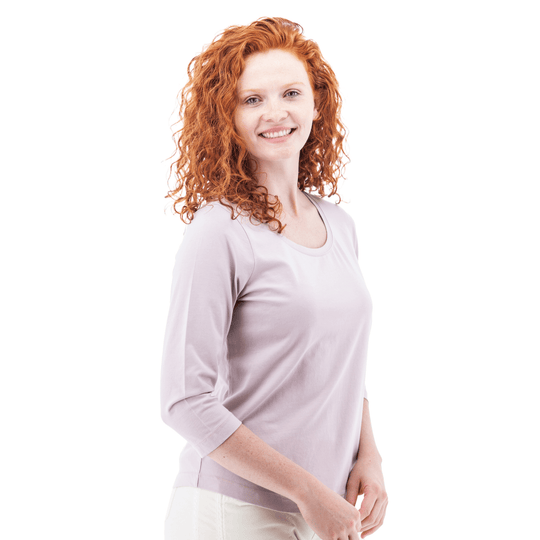 Light lavender three-quarter sleeve top on a model against a white background