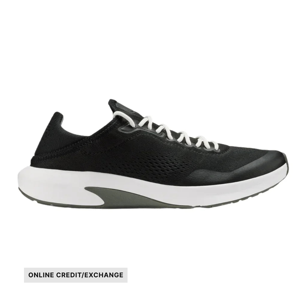 Black athletic shoe in side view with white sole and white laces