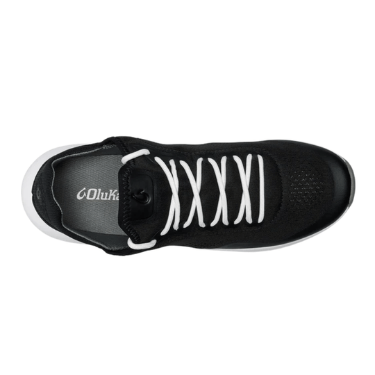Black low-top sneaker with white bungee laces, gray insole, and a white sole, shown from above