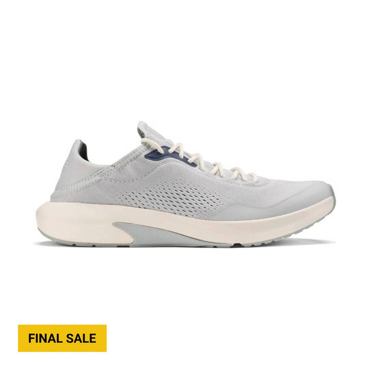 Light gray athletic sneaker with white laces, a thick cream sole, and side mesh cutouts