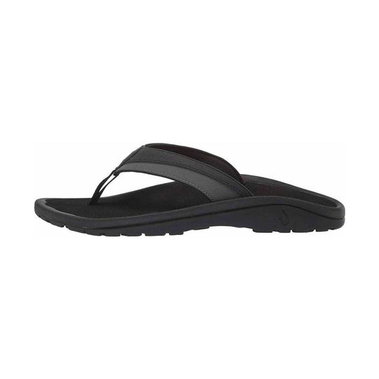 Black thong sandal with a contoured footbed and rugged tread sole