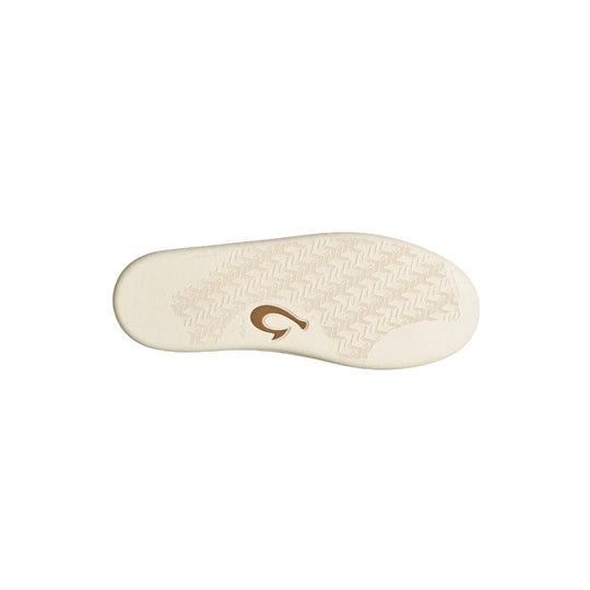 Cream shoe outsole with a textured tread pattern and brown logo at center