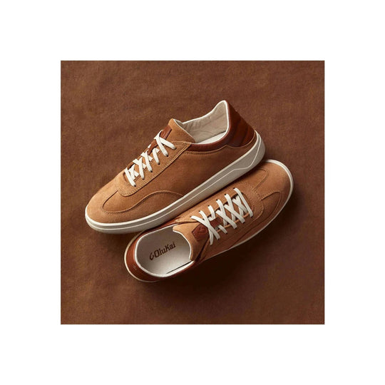 Pair of tan suede sneakers with white laces and off-white soles