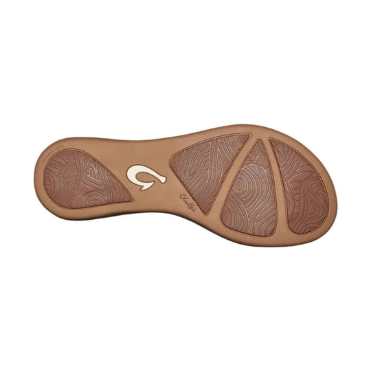 Tan sandal outsole with textured rubber tread and cutout grip panels
