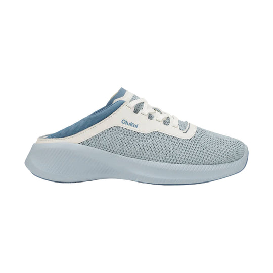 Light blue slip-on sneaker with white laces, mesh upper, and thick sole