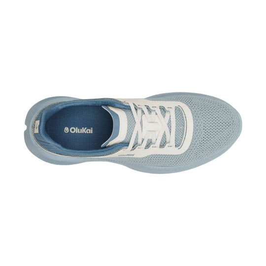 Light blue mesh running shoe with white laces and Olukai branding on the insole