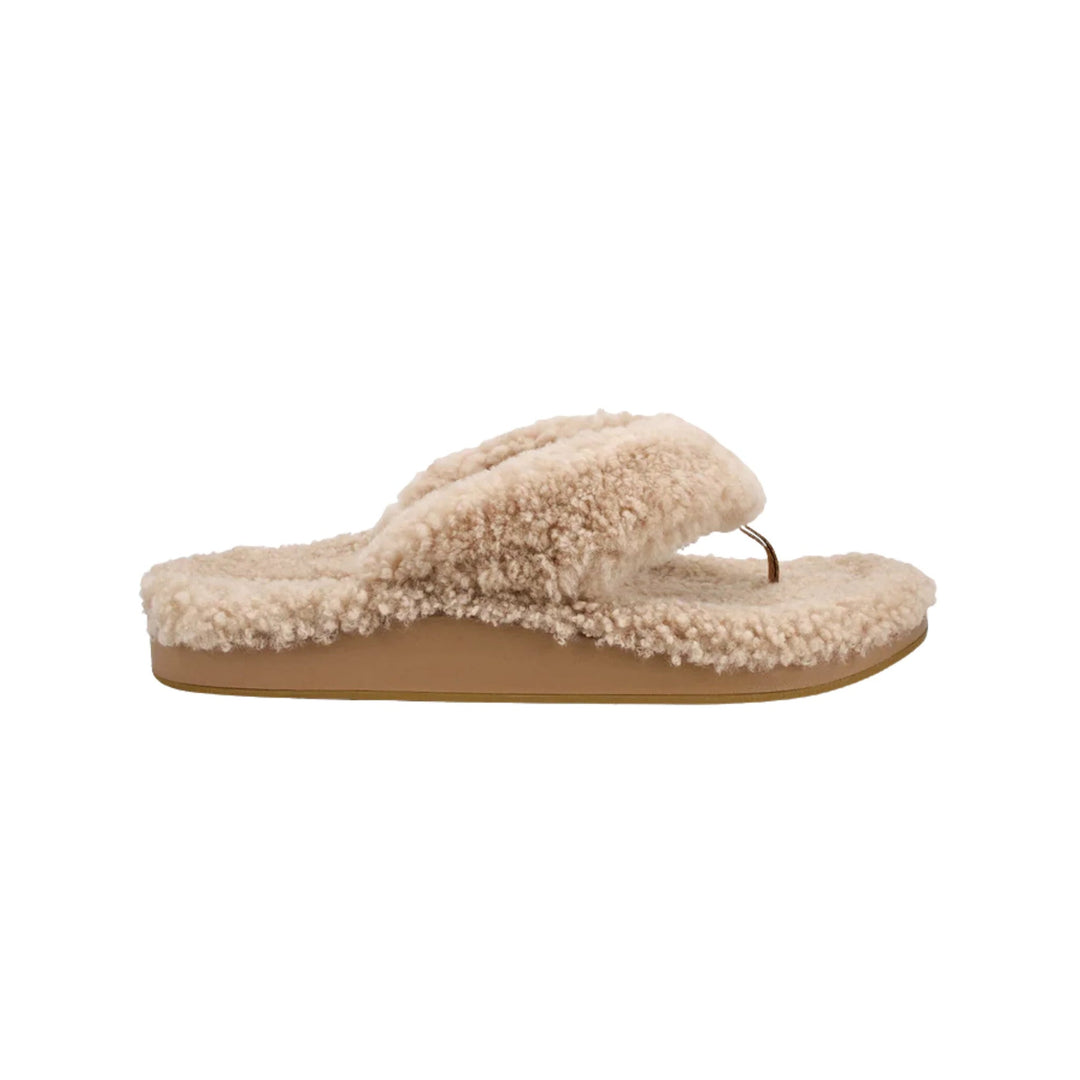 Cream fuzzy thong slide sandal with a tan platform sole