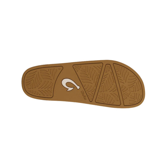 Tan rubber sandal outsole with leaf-pattern tread and printed branding