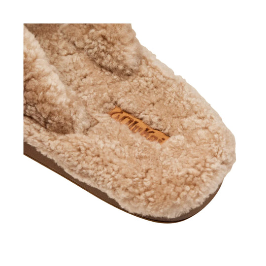 Tan fuzzy slipper sandal with shearling lining and logo on the footbed