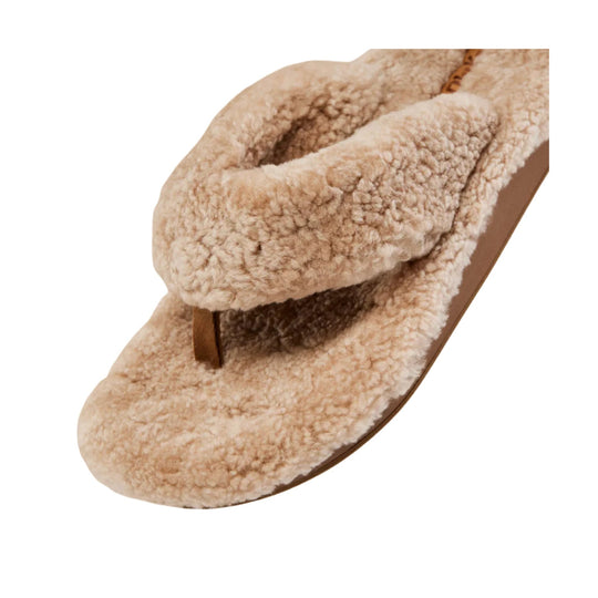 Tan fuzzy thong slipper sandal with plush faux-fur straps and footbed