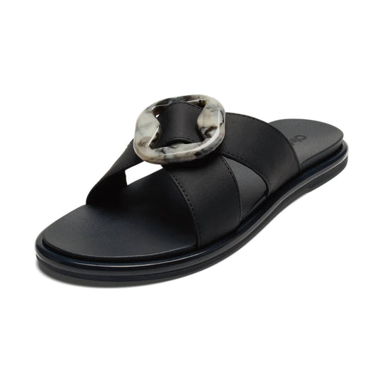 Black slide sandal with wide crisscross straps and a marbled oversized buckle