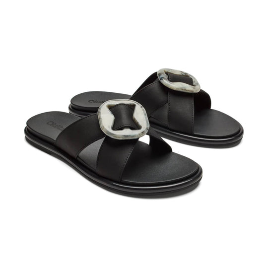 Black slide sandals with wide straps and marbled square buckles