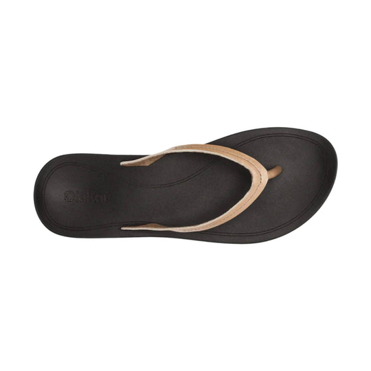 Black flip-flop sandal with tan leather thong strap, viewed from above