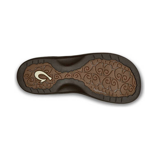 Sandal outsole with dark brown tread and tan patterned traction zones