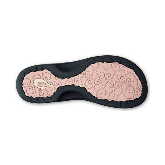 Black and pink sandal outsole with textured tread and arch support