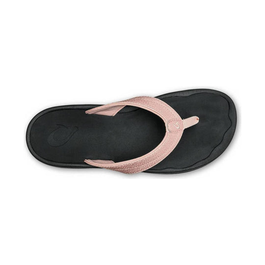 Pink thong sandal with a black footbed and textured straps