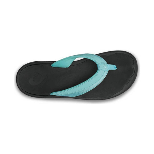 Black flip-flop sandal with a turquoise strap and toe post, viewed from above