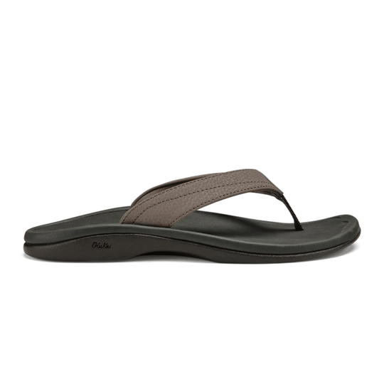 Thong sandal with dark gray footbed, taupe strap, and OluKai logo