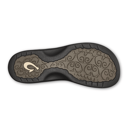 Sandal outsole with black tread and taupe patterned traction insert