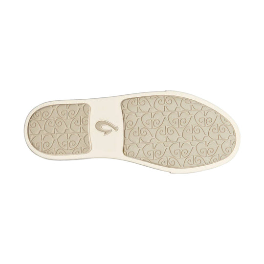 Beige rubber shoe outsole with embossed swirl tread pattern and small center logo