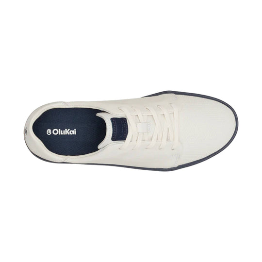 White golf shoe with navy lining, lace-up front, and navy trim
