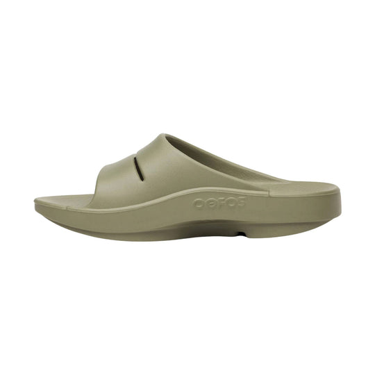 Beige foam slide sandal in side view with a thick platform sole and molded footbed