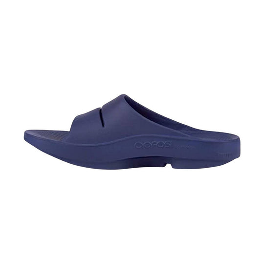 Blue slide sandal with 'Oofos' branding on a white background
