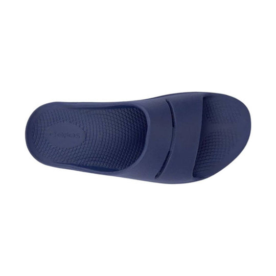 Navy blue slide sandal on a white background