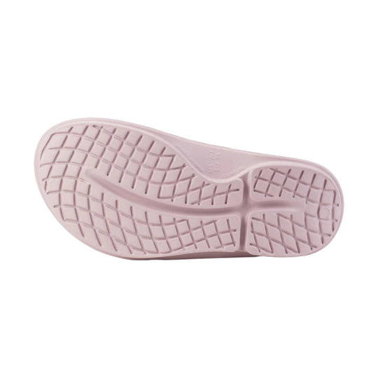 Light pink slip-on sandal outsole with grippy tread pattern