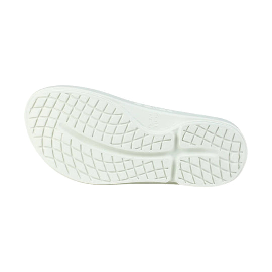 White flip-flop outsole with a textured tread pattern