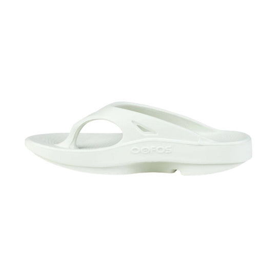 White thong sandal with a cushioned foam sole and embossed OOFOS logo on the side