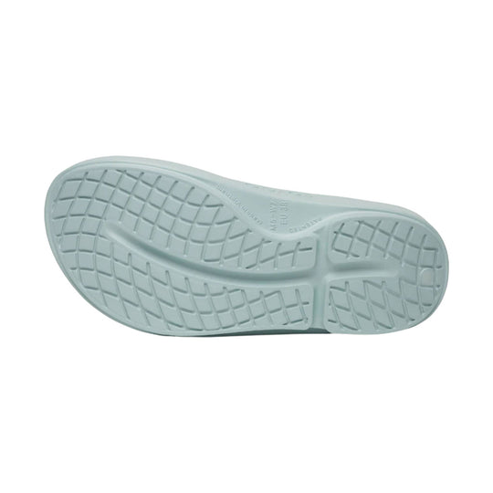 Light mint rubber flip-flop sole with tread pattern and size markings